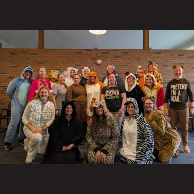 Staff photo of everyone dressed as zoo animals