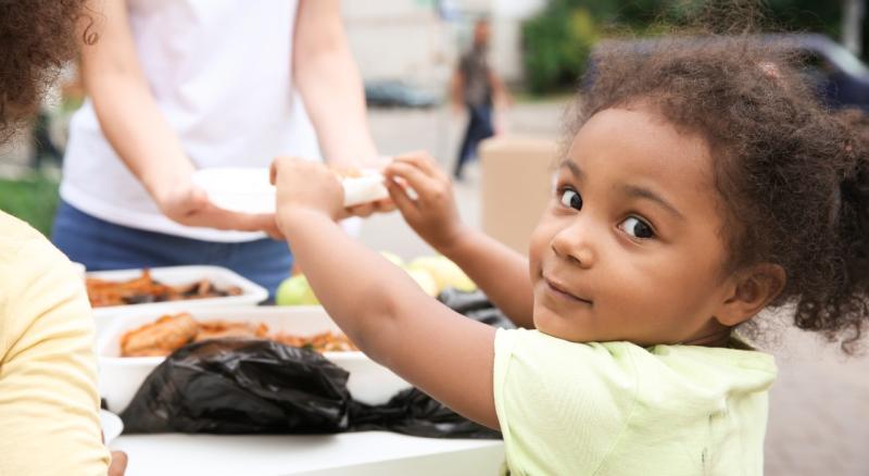 Young girl smiles while playing
